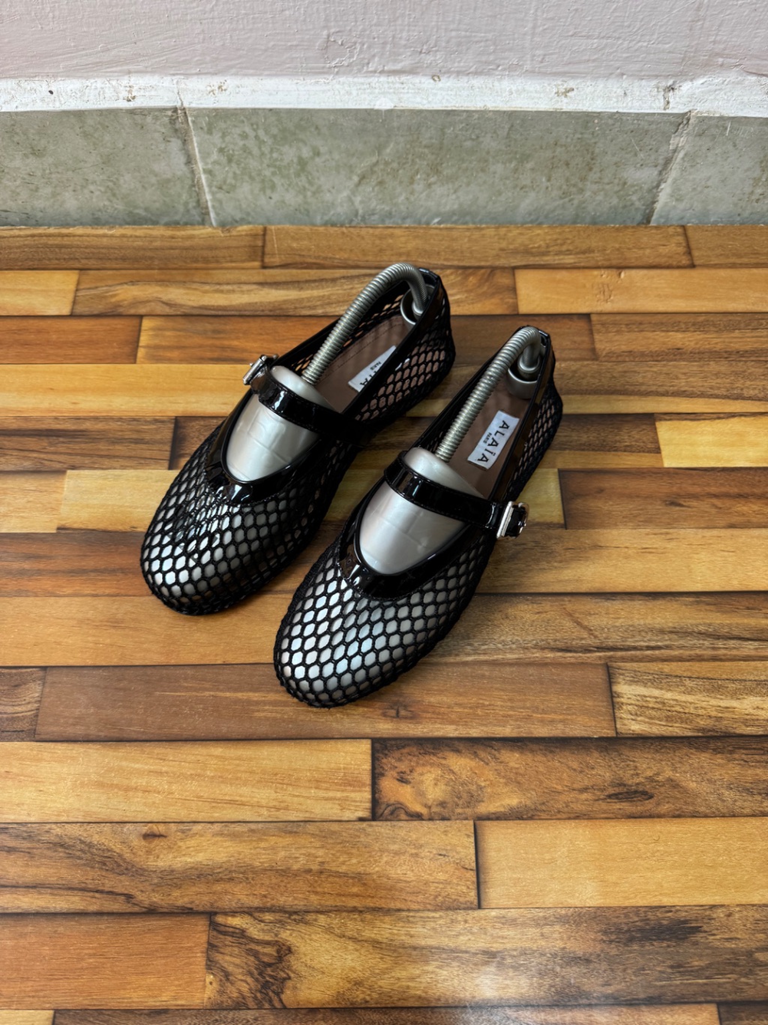 ALAIA FISHNET BALLET FLATS