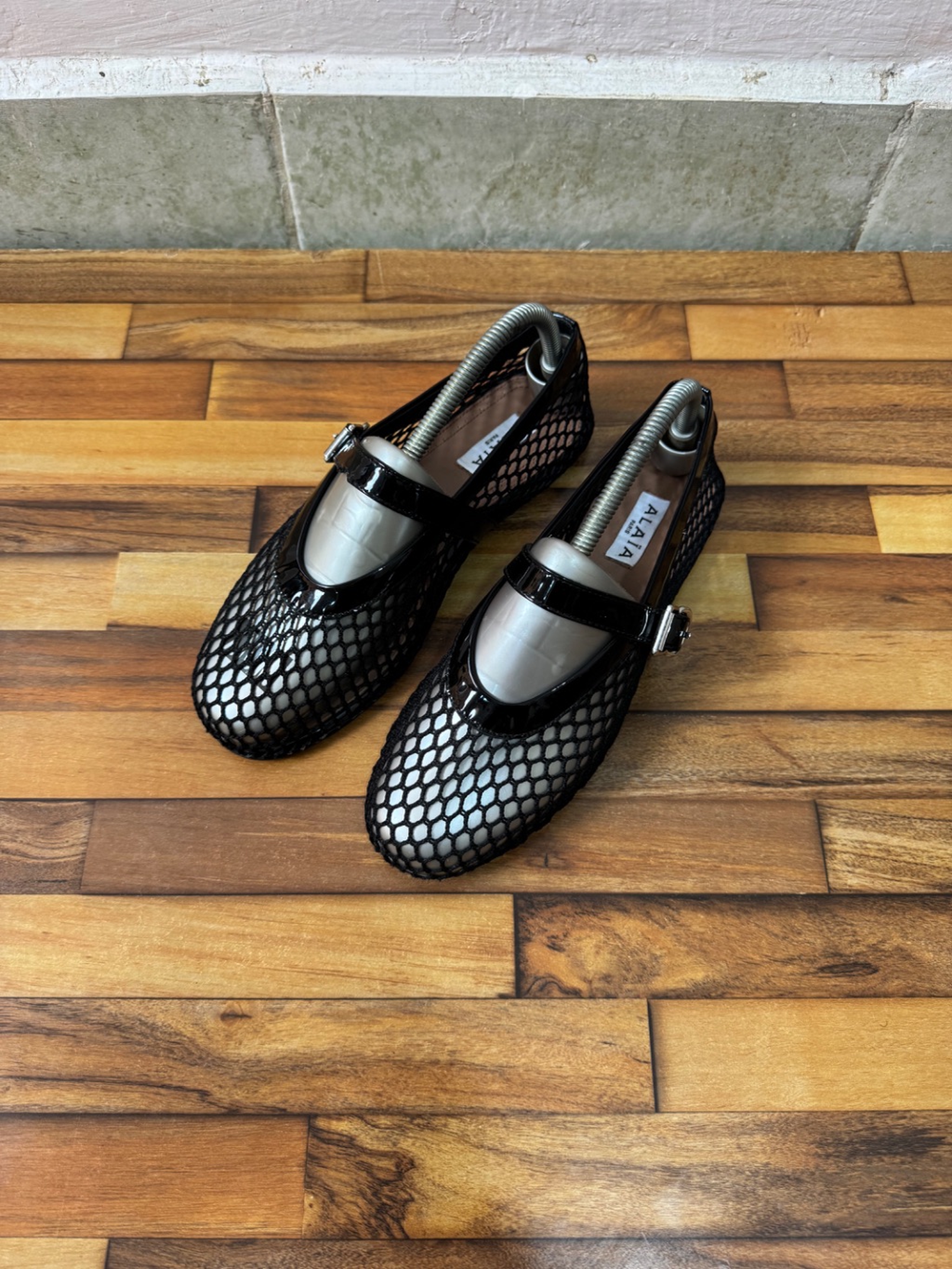ALAIA FISHNET BALLET FLATS