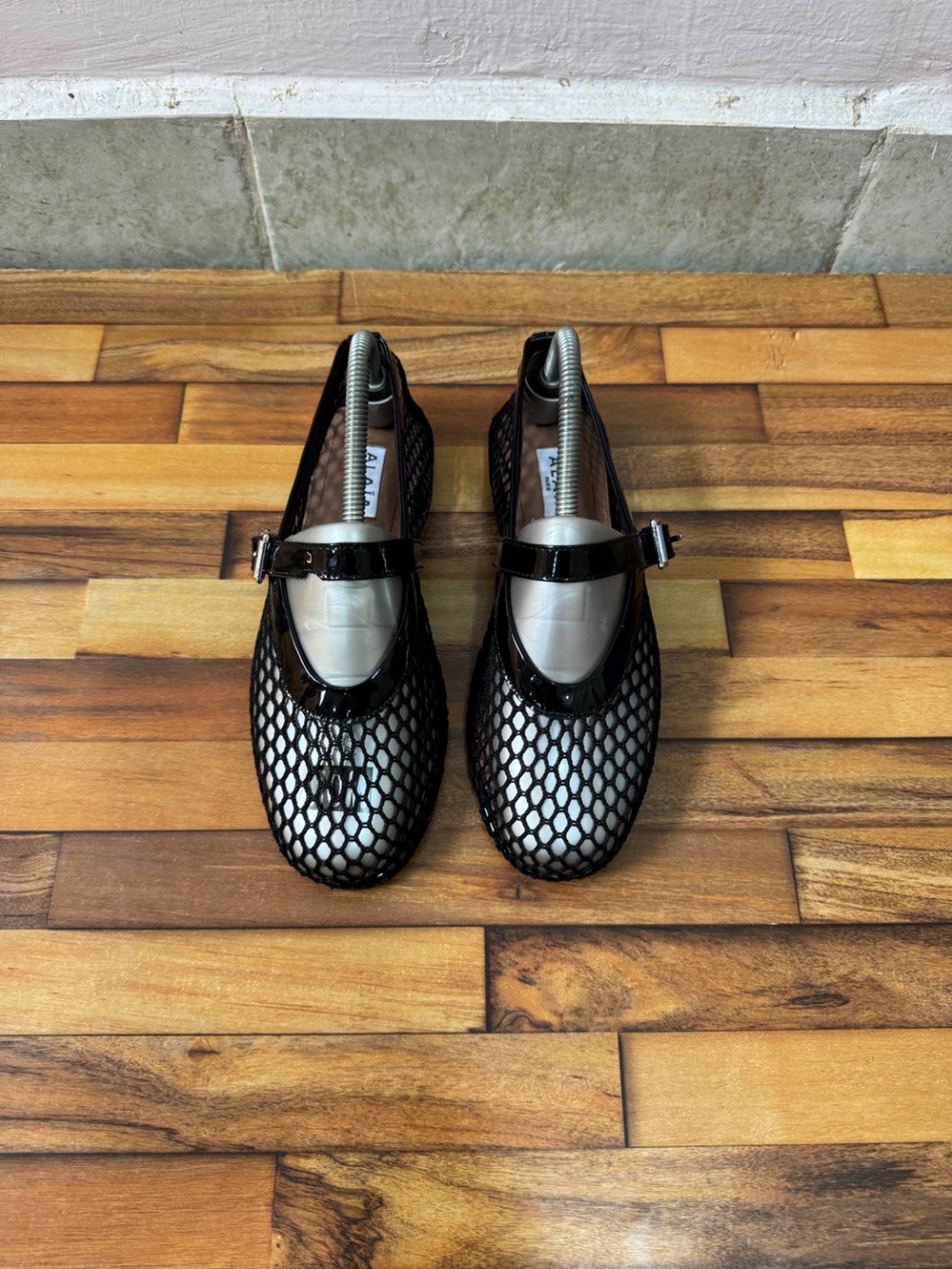 ALAIA FISHNET BALLET FLATS
