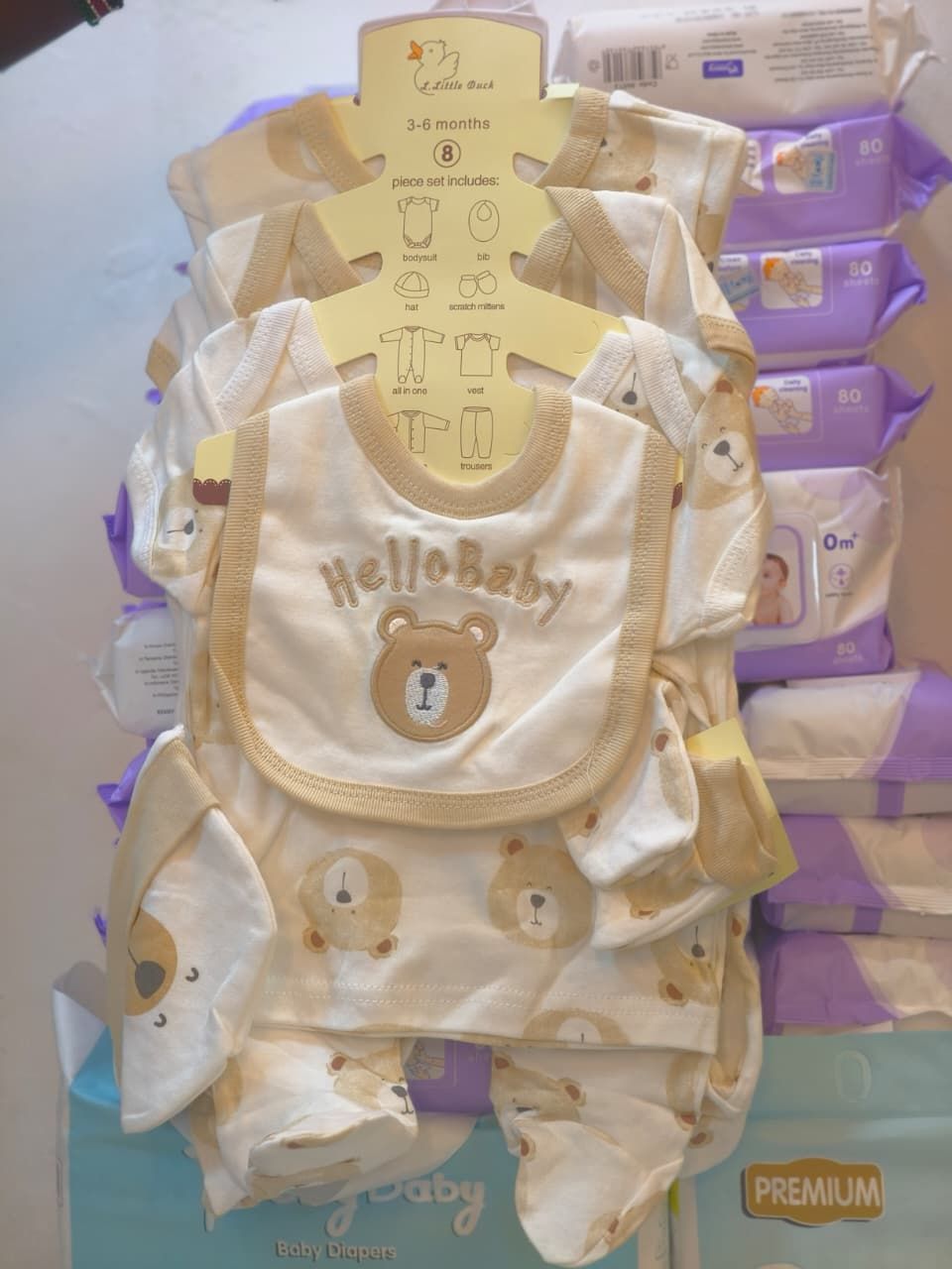 8-Piece Set: Onesie, Hat, Mitts, Bib, & More