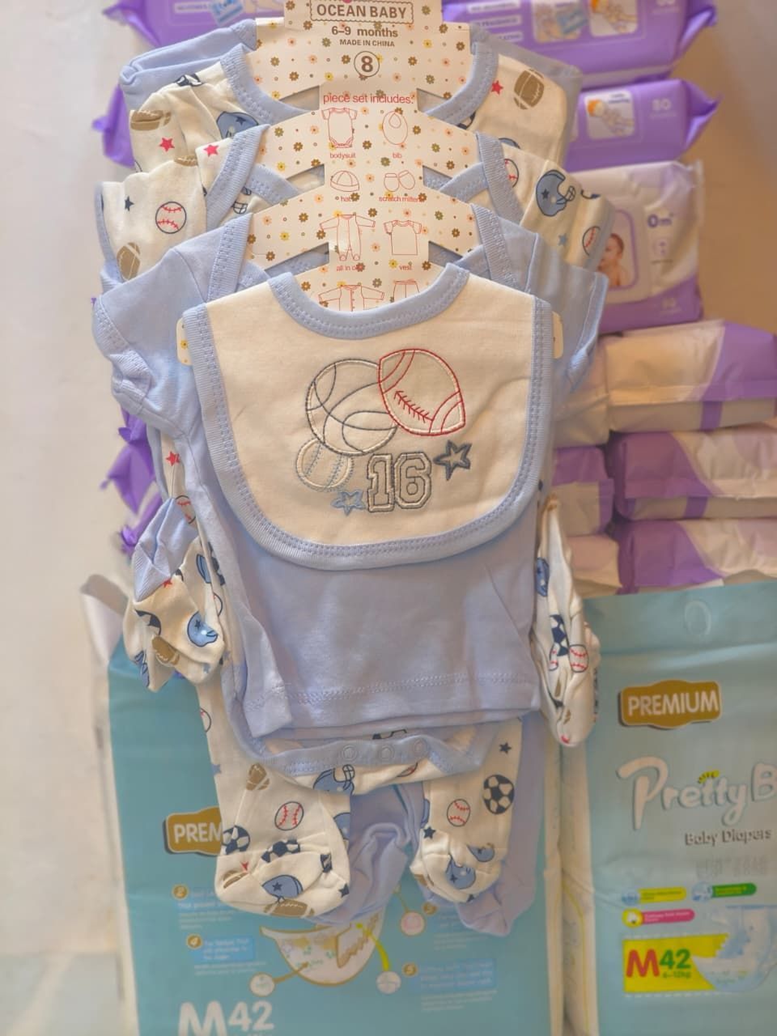 8-Piece Set: Onesie, Hat, Mitts, Bib, & More