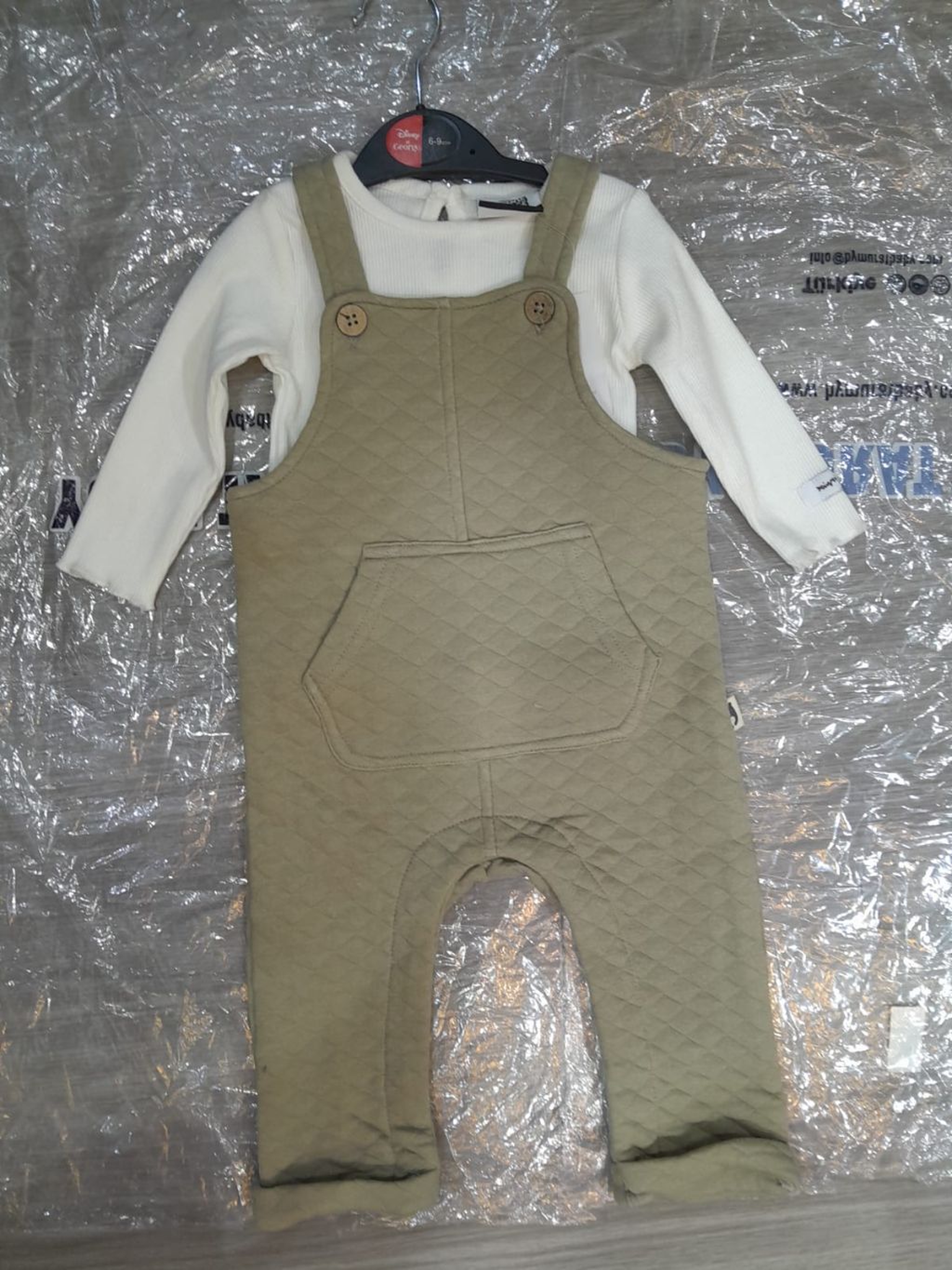 Cozy Baby Unisex Quilted Sage Green Overalls and Long Sleeve Tee Set Full-Length Quilted Dungaree Jumpsuit, Printed Top, and  a pair of socks