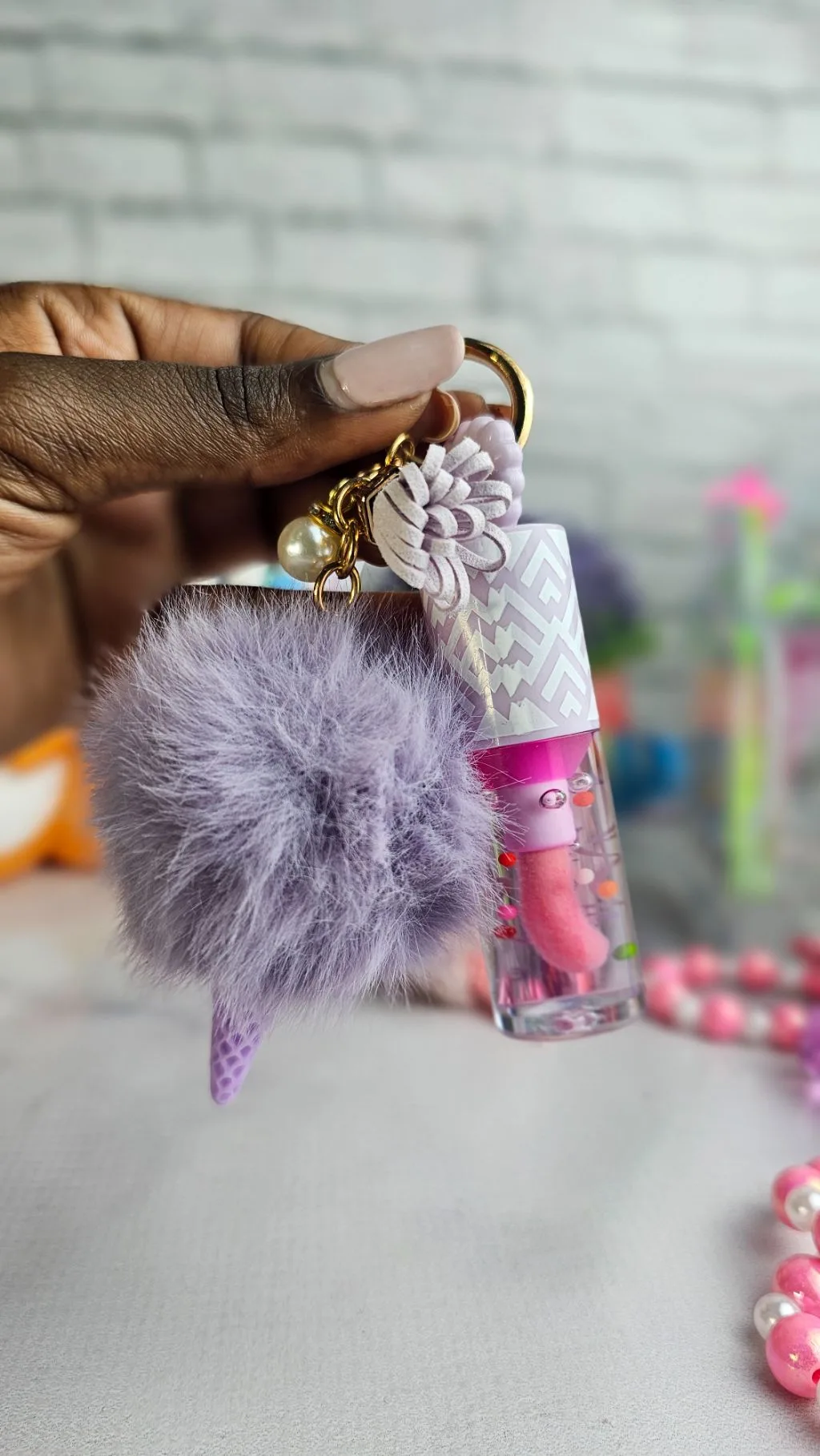 Colour changing pompom lipgloss