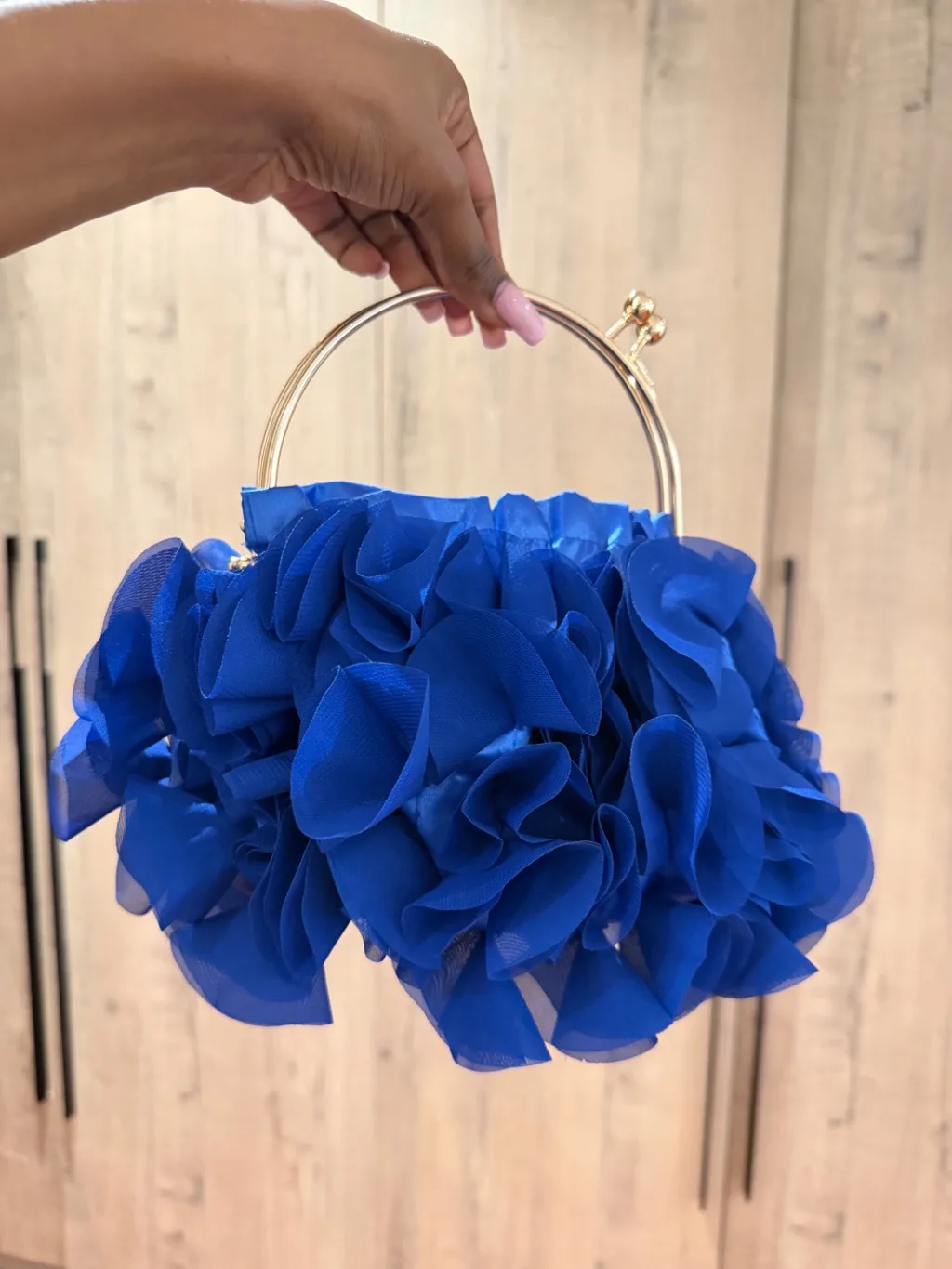 Blue floral clutch bag