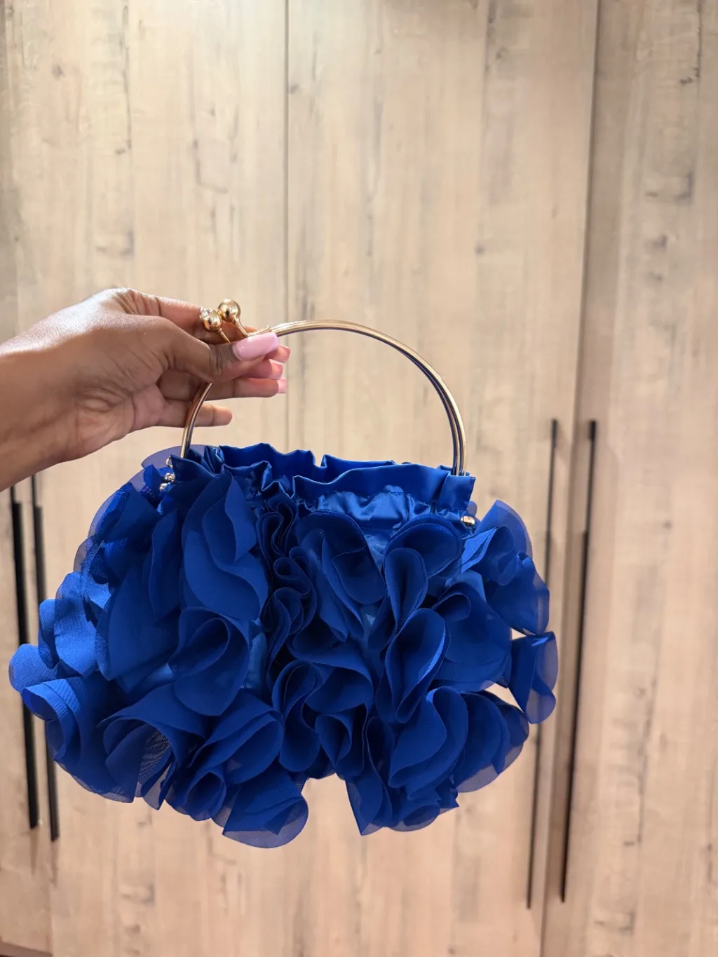 Blue floral clutch bag