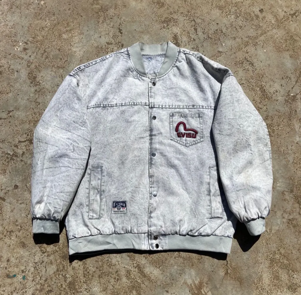 Vintage Evisu acid wash denim bomber jacket with embroidered seagull logo.