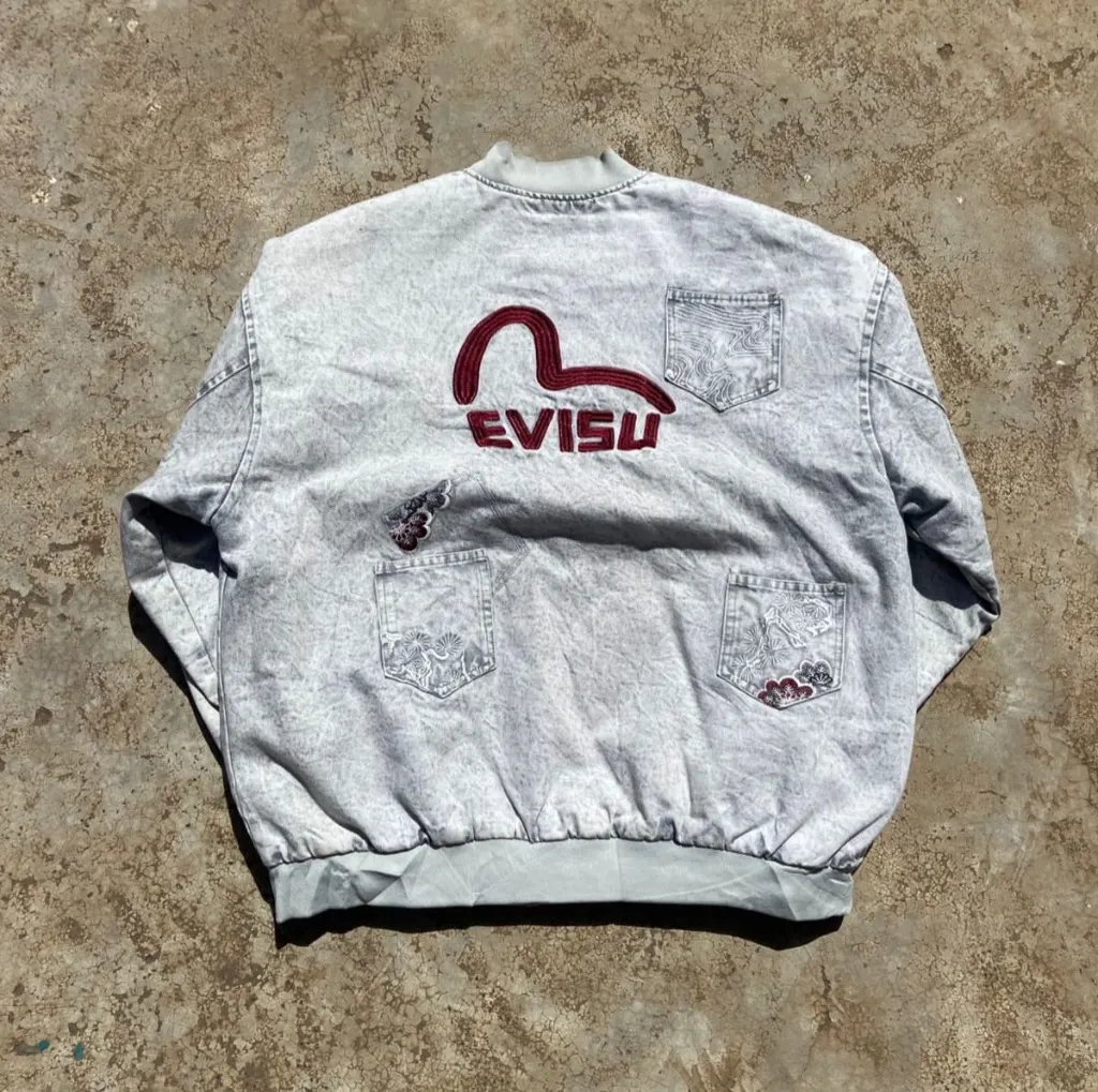 Vintage Evisu acid wash denim bomber jacket with embroidered seagull logo.