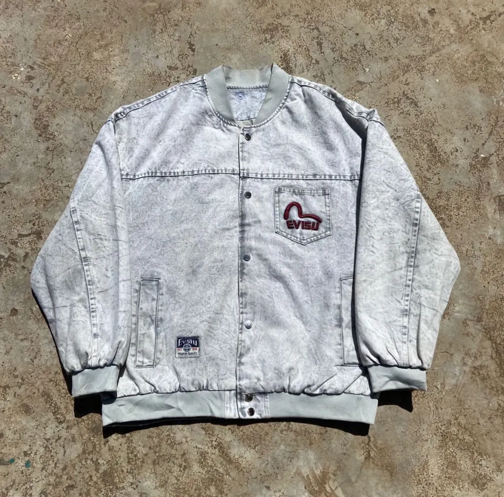 Vintage Evisu acid wash denim bomber jacket with embroidered seagull logo.