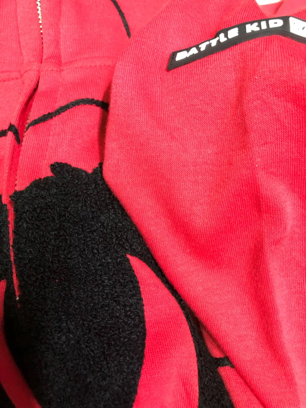 Red full-zip hoodie with Spider-Man web print and 3D hood eyes.