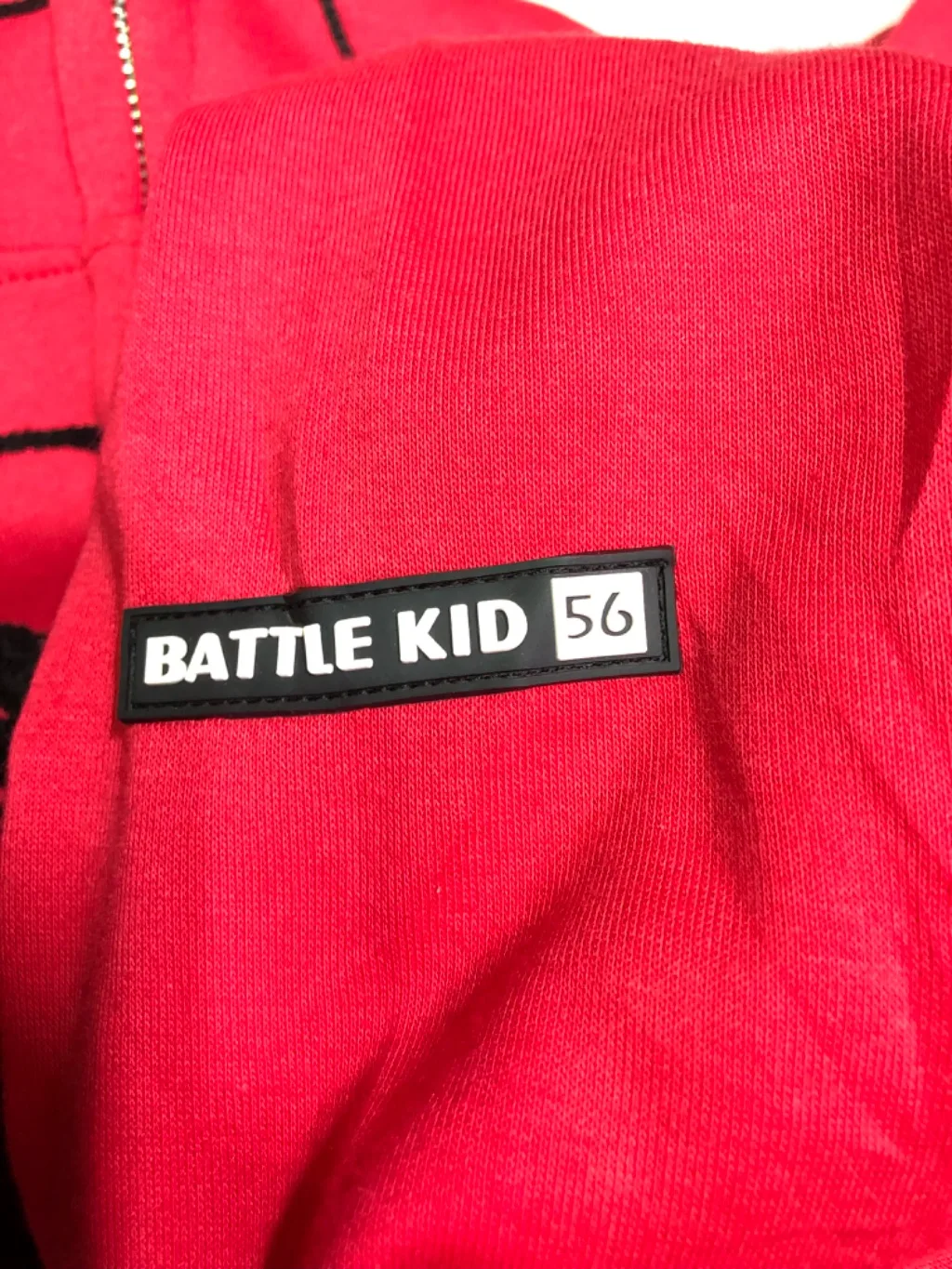 Red full-zip hoodie with Spider-Man web print and 3D hood eyes.