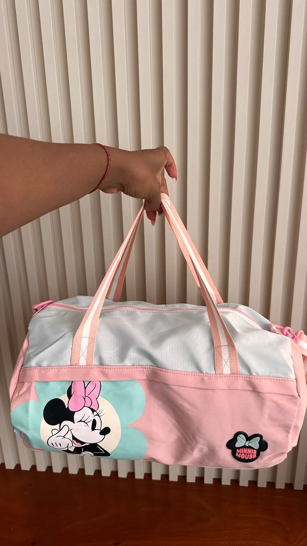 This pastel pink and light blue Minnie Mouse Disney duffle