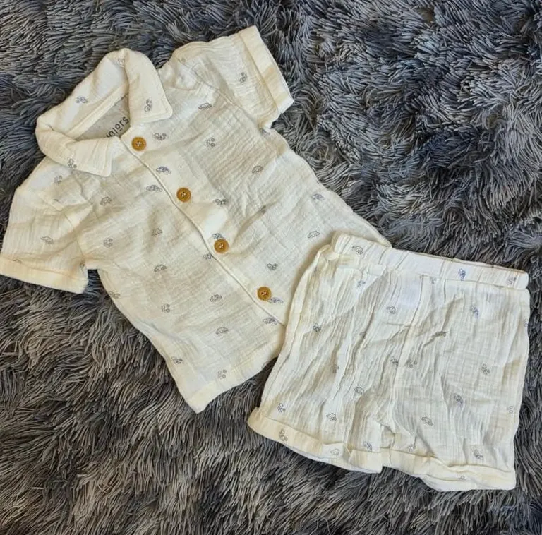 Muslin two-piece baby outfit with a car print.